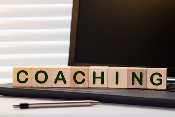 coaching word on a wooden blocks