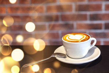 A cup of coffee on a with heart, valentines day, red wall