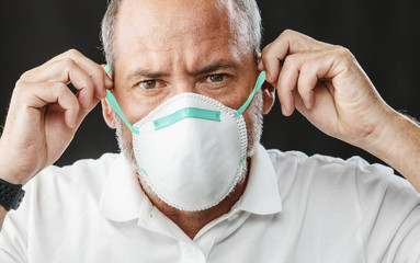 Doctor wearing an anti virus protection mask to prevent others from corona COVID-19 and SARS cov 2...