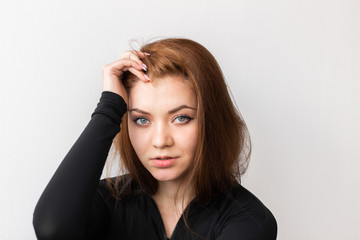 Fototapeta premium confused girl clings to her head