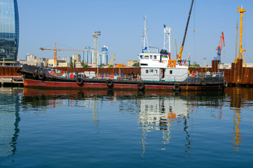 Fototapeta premium Ship moored to the pier with cranes