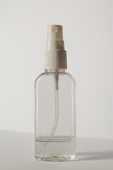 Antibacterial spray for hands close up. Virus protection alcohol disinfectant spray bottle on white background. Antibacterial spray for hands, antiseptic isolated. Vertical photo