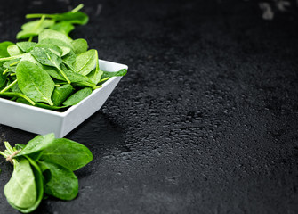 Portion of fresh Spinach (close-up shot)