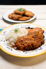 Mexican tuna patties also called "tortitas" and rice on white background