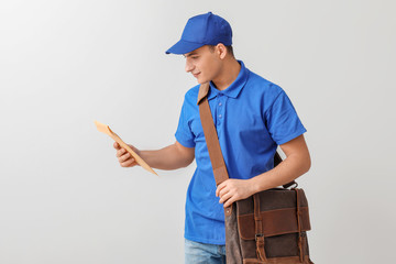 Postman with letters on light background