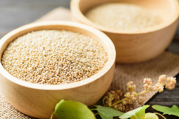 Organic raw brown quinoa seed in a bowl, healthy food