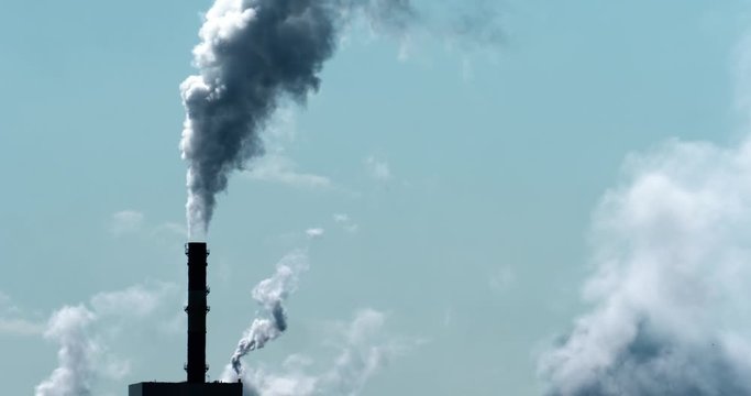 smokestacks billowing smoke climate change