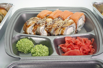 Food delivery and sushi rolls close-up. The concept of food delivery.