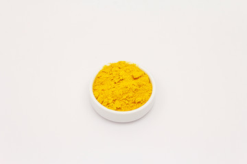 Dry turmeric powder isolated on white background