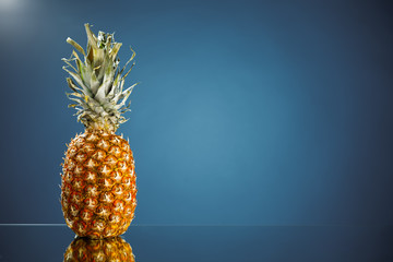fresh pineapple on blue background