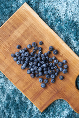 Blueberries on a cutting board