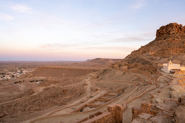 Naklejka premium red rocks in the desert old town germassa