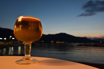 Beer on a bar table with sunset
