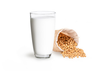 Glass of soy milk and soy beans isolated on white