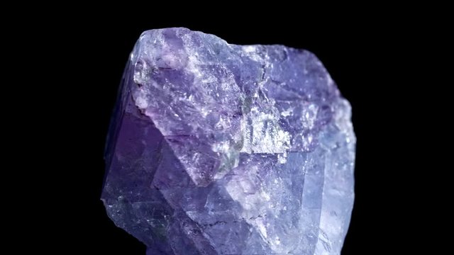 Mineral Celestine. The texture of the mineral. Macro shooting of natural gemstone. The raw mineral. black background.
