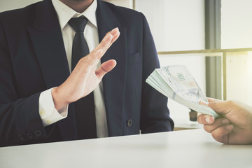 Business man refusing money to take the bribe the concept of corruption and anti bribery
