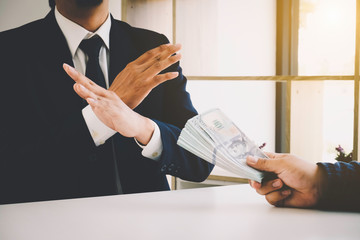 Business man refusing money to take the bribe the concept of corruption and anti bribery