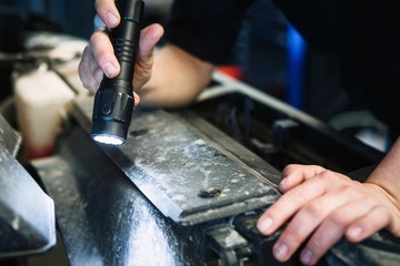 Mechanic checking a car