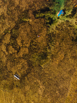 Aerial shot of  kite surfer on colorful waters reef