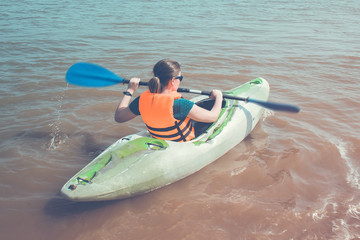 Girl on a kayak.