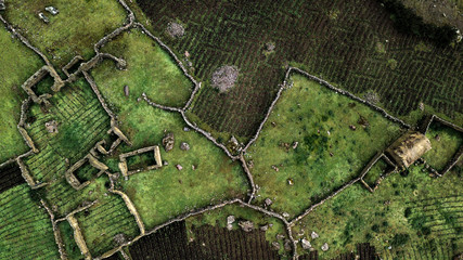Aerial top-down view on the Andean style of animal agriculture settlements high in the Peruvian...
