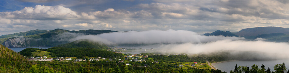 Fototapeta na wymiar Panorama of low clouds over Bonne Bay at Norris Point Newfoundland in the evening