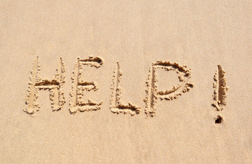 Help written on the beach. Can be use for Summer background and Human rights , Covic-19 protection concept. Top view. Flat lay.
