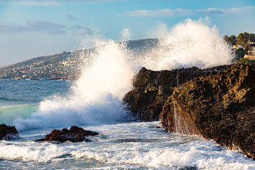 Ocean wave crashing against shore