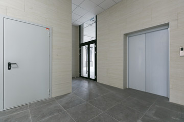 Plakat empty pure commercial office building undecorated in gray colors.open space office