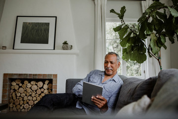 Senior man with a tablet