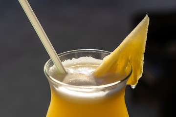 Freshly squeezed juice from pineapple in a glass goblet © OlegD