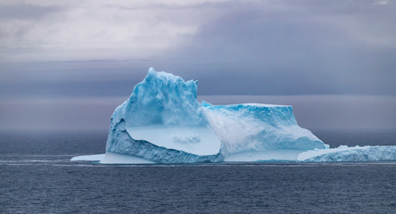 Icebergs floating in the Antarctic after calving off the numerous glaciers in the area.