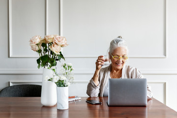 Senior woman working on a laptop