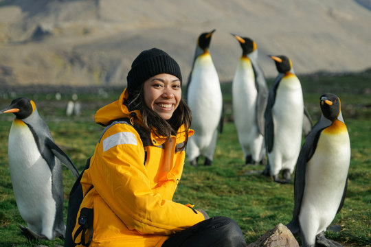 Woman with Penguins in Background