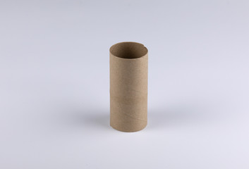The core of the tissues that are depleted is only brown cardboard paper before taking it recycling. It was taken in the studio on the white background.