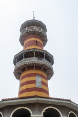 Fototapeta na wymiar Tower WITHUN THASANA or the sage lookout in Bang Pa-In Royal Palace or the Summer Palace that is a palace complex formerly used by the Thai kings in Ayutthaya Province Thailand.