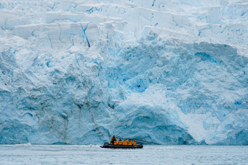 Boat in front of Giant Iceberg