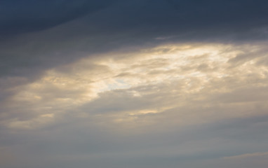 gloomy stormy sunset sky with dark clouds