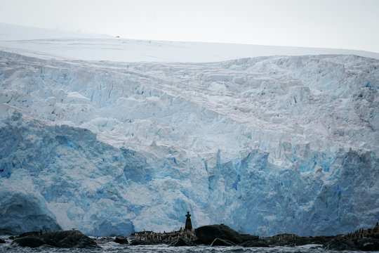 Statue in an Island in front of Iceberg
