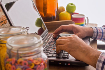 man working with his laptop at home