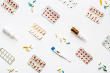 Cold, flu and virus treatment - flat lay with medicine - on white background top view