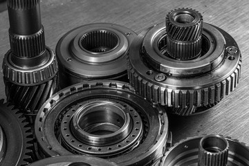 Set of various engine and gearbox spare parts. Shiny gears for planetary gearbox.Metal ...