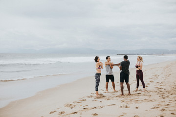Pre-workout stretch at the beach