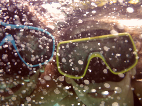 Close-up Of People Snorkeling In Sea