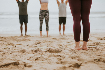 Yoga class by the beach