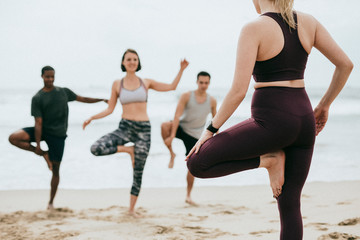 Yoga class by the beach