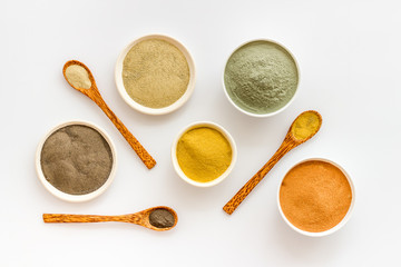 cosmetic clay - Yellow, red, white, blue and black dry powder - top-down flat lay