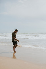 Fototapeta na wymiar Playful man on the beach