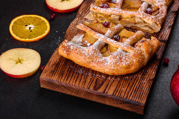 Delicious fresh pie baked with apple, pears and berries