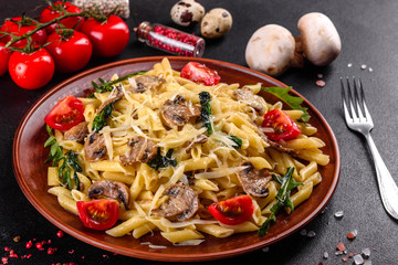 Pasta with mushrooms, cheese, spinach, rukkola and cherry tomatoes
